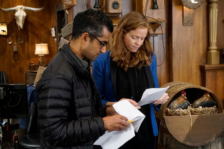 Writer of the episode Sanjay Shah working on notes during filming.