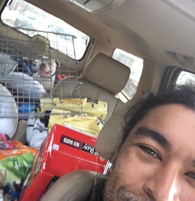 Boo smiling in the back of Oliver’s car.