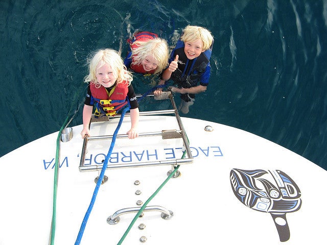 Bouncing off the stern to go snorkeling.