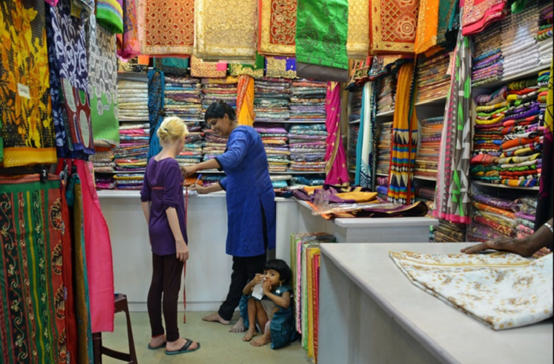 Getting fitted for a sari in Sri Lanka.