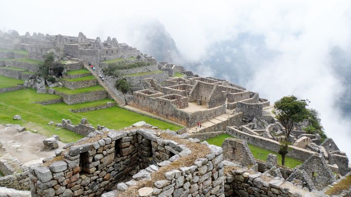 Machu Picchu veiled by early morning clouds and shrouded in stillness 