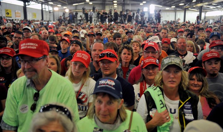 Supporters of Republican Presidential nominee Donald Trump listen as he addresses a capacity crowd at the Jefferson County Fairgrounds - Rodeo Arena & Event Center in Golden, Colorado on October 29, 2016.