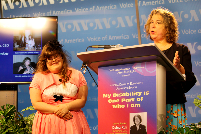 Sara Ruh with Debra Ruh photographed Speaking at the Voice of America During National Disability Employment Awareness Month 2