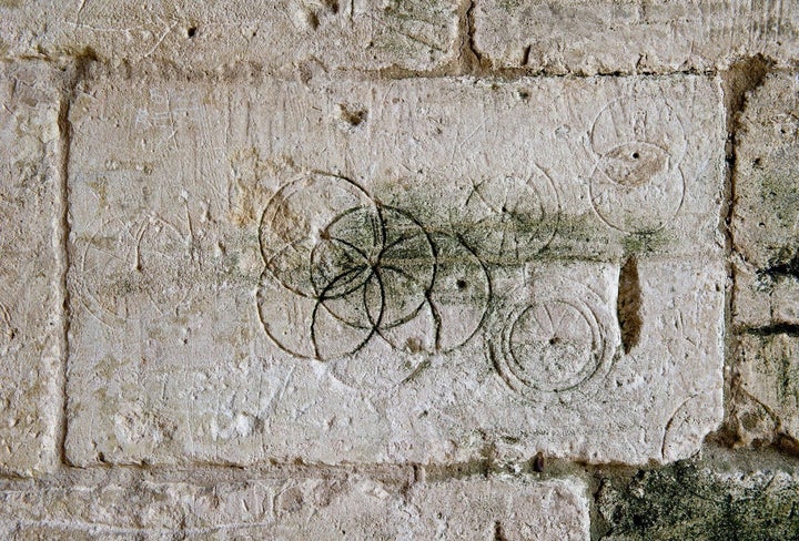 Daisy wheels inscribed with a pair of compasses or dividers found in Saxon Tithe Barn, Bradford-on-Avon 