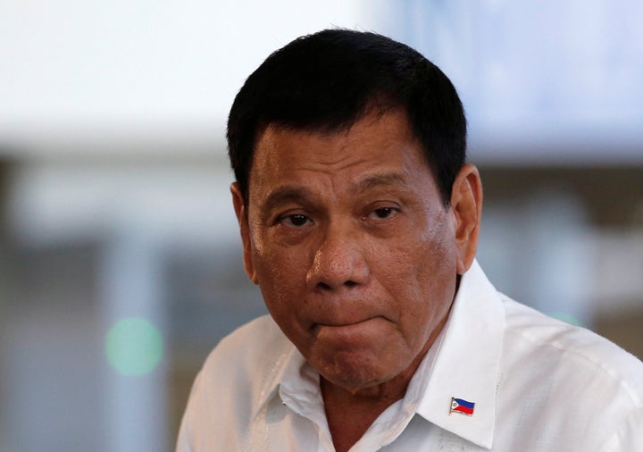President Rodrigo Duterte listens to a reporter's question during a news conference before his departure for Japan.