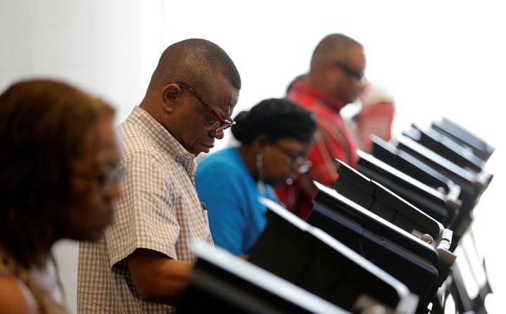 North Carolinians casts their ballots during early voting at the Beatties Ford Library in Charlotte.