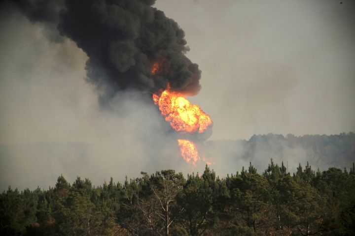 Flames shoot into the sky from a gas line explosion in western Shelby County, Alabama, on Monday.