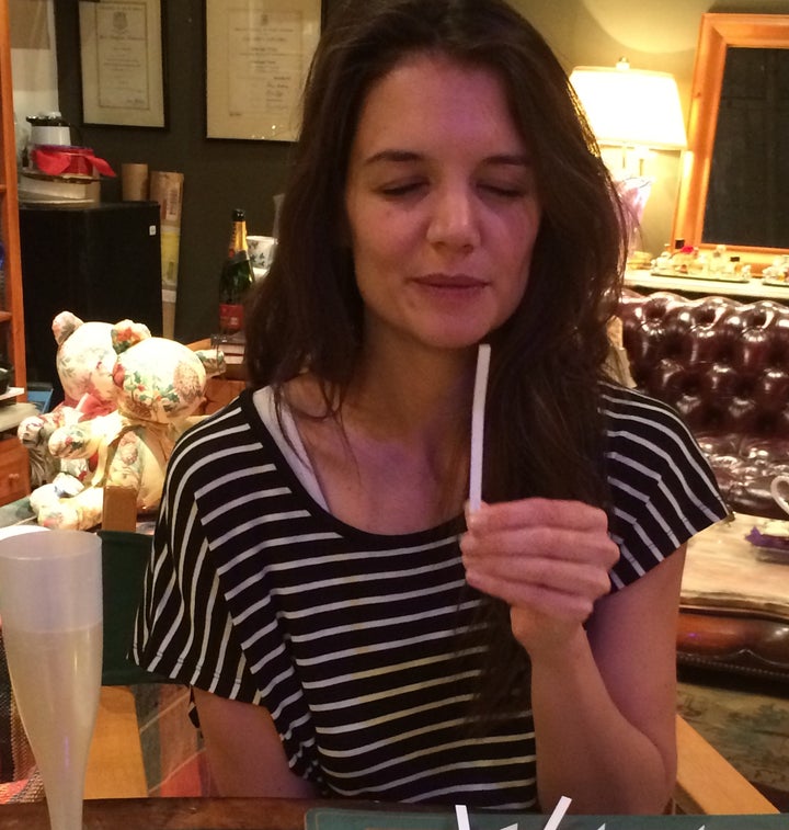 Katie Holmes evaluating scents at The Scentarium