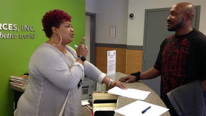 Heaven Godley chats with Angela Mason, a receptionist at REACH Health Services, an opioid treatment center in Baltimore. In a