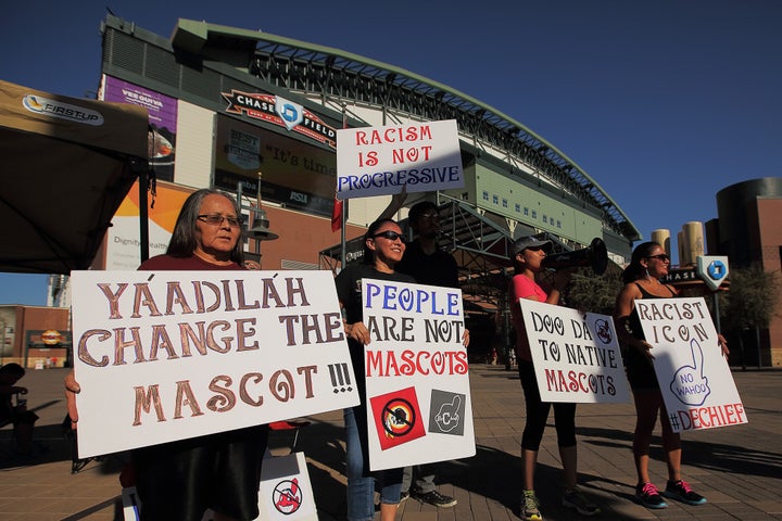 Native American protesters demonstrate against the use of the Chief Wahoo logo before a Cleveland game in Arizona in 2014.