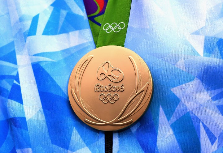 An Argentinan Olympian is seen with his gold medal at the Rio 2016 Olympic Games.