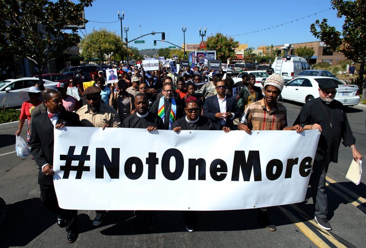 Demonstrators hold a march and rally on October 1 to protest the fatal police shooting of Ugandan immigrant Alfred Olango in