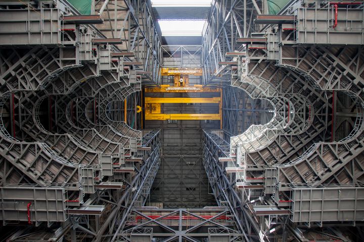 New SLS work platforms line the inside of a former space shuttle bay in the Vehicle Assembly Building at NASA’s Kennedy Space Center. SLS will be stacked in the middle, and the platforms will slide together to enclose the rocket’s core stage and solid rocket boosters.