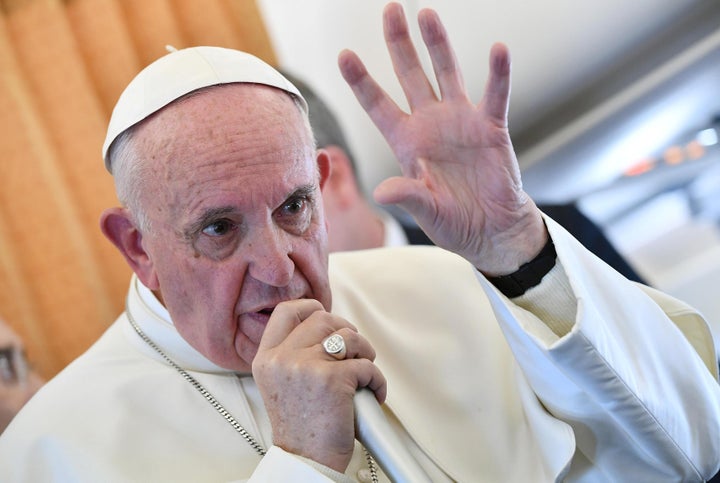 Pope Francis speaks to journalists on his flight back to Rome, Italy Nov. 1.