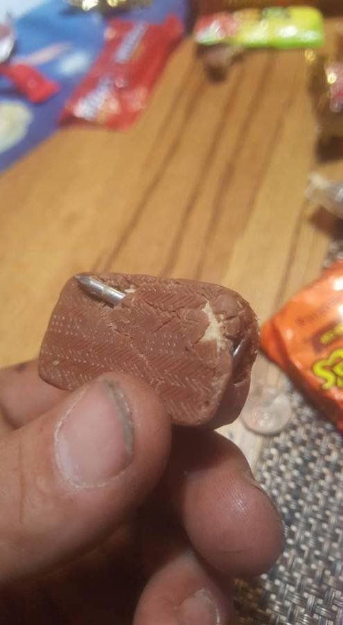A firefighter in Fremont Michigan claims his kids came home from trick or treating with tainted candy including a Snickers bar with a nail.