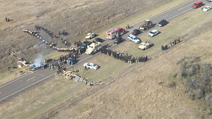 Protesters and police face off on Highway 1806 on Oct. 27, when demonstrations escalated and 141 people were arrested.