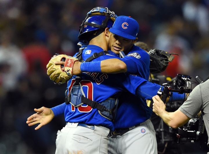 Chicago Cubs players Willson Contreras (40) and Addison Russell celebrate after defeating the Cleveland Indians in game six of the 2016 World Series.
