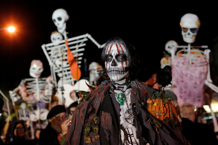 Revelers take part in a Halloween parade in Manhattan, New York on Oct. 31. High temperatures smashed records in se
