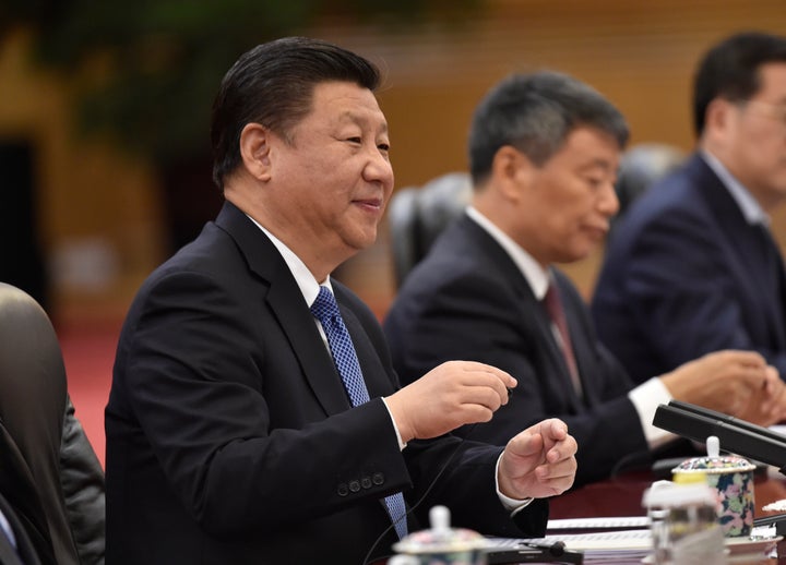 China's President Xi Jinping speaks with Belgium's Prime Minister Charles Michel in the Great Hall of the People on Octo
