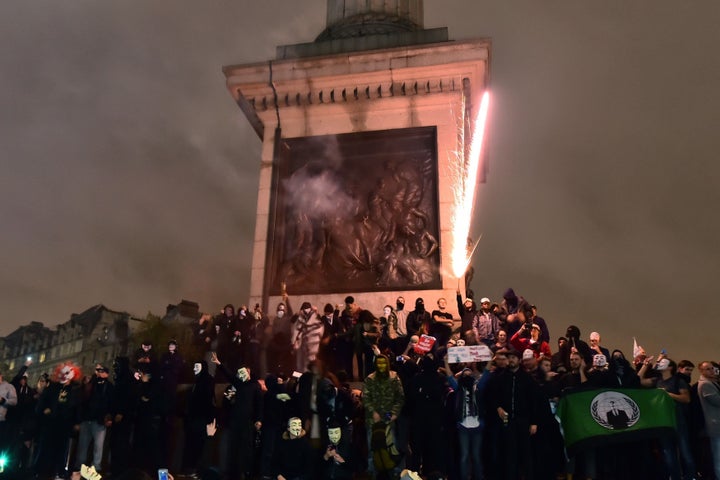 Protestors set off fireworks in Trafalgar Square during last year's Million Mask March