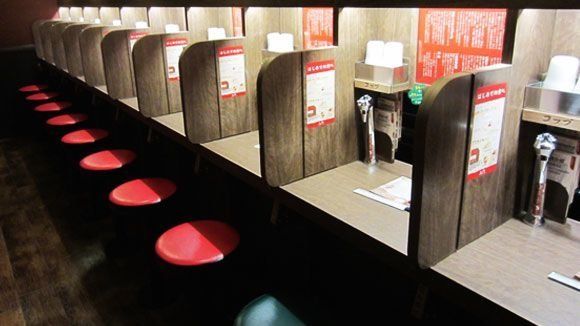 Flavor concentration booths for slurping noodles in solitude.