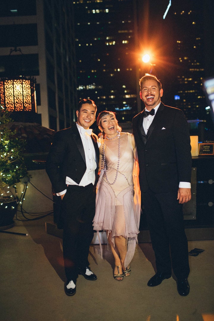 The grooms posing with actress Naomi Grossman who plays Pepper in the miniseries. 