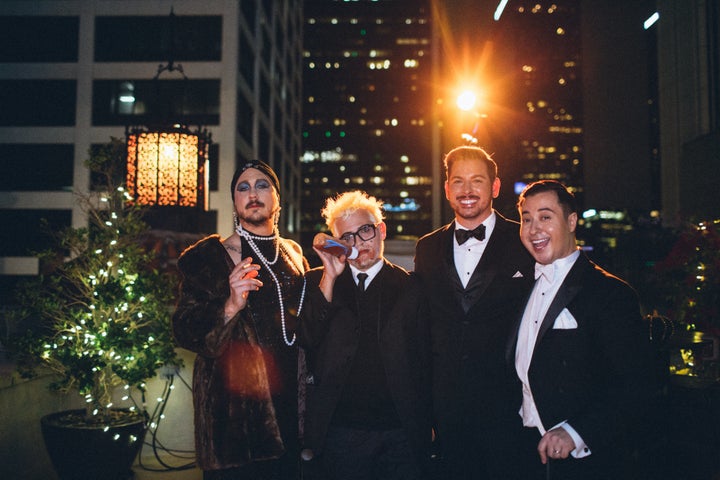 One guest (on the left) dressed up as Denis O'Hare's "Hotel" character Liz Taylor.