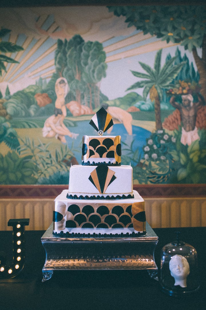 The wedding cake is an Art Deco masterpiece. 