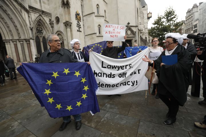 Protesters outside the High Court in London today