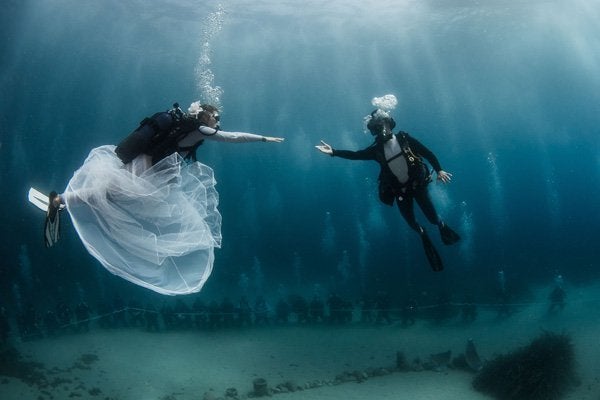 Underwater Wedding at Hôtel Métropole in Monte-Carlo: Why, hello there, adventure! Anchors away as you swim 400-feet below sea at Monaco's luxe and colorful Larvotto Beach. Your ceremony will be helmed by the famed Pierre Frolla, an award-winning free-diver, and you’ll get professional divers and a priest to accompany you and up to 22 guests to witness the underwater ceremony. Once you catch your breath above water, host your reception in the stunning gardens or the bar and pool house designed by the one-and-only Karl Lagerfeld.