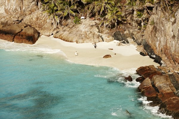 <p><strong>A Secluded Paradise at Fregate Island Private in the Seychelles: </strong>Talk about a remote, luxurious locale. This resort takes up the entire private island, where personal butlers will greet your guests in style. There’s a maximum capacity of 79 people on this exotic piece of heaven, and your nuptials buyout comes complete with a complimentary “Aroma Lovers” treatment at the Rock Spa, a traditional Seychellois trio wedding cake, a romantic candlelit dinner on the beach, and a collection of photos from your #MeetTheJones extravaganza.</p>