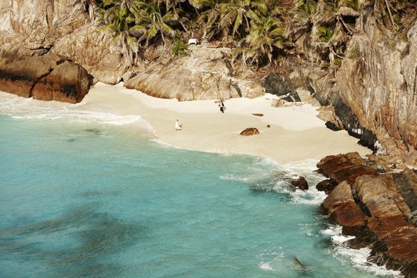 A Secluded Paradise at Fregate Island Private in the Seychelles: Talk about a remote, luxurious locale. This resort takes up the entire private island, where personal butlers will greet your guests in style. There’s a maximum capacity of 79 people on this exotic piece of heaven, and your nuptials buyout comes complete with a complimentary “Aroma Lovers” treatment at the Rock Spa, a traditional Seychellois trio wedding cake, a romantic candlelit dinner on the beach, and a collection of photos from your #MeetTheJones extravaganza.