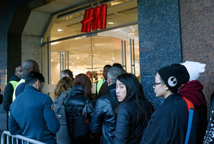 People queue in front of the H&M Haussmann store in Paris on Thursday 3 November