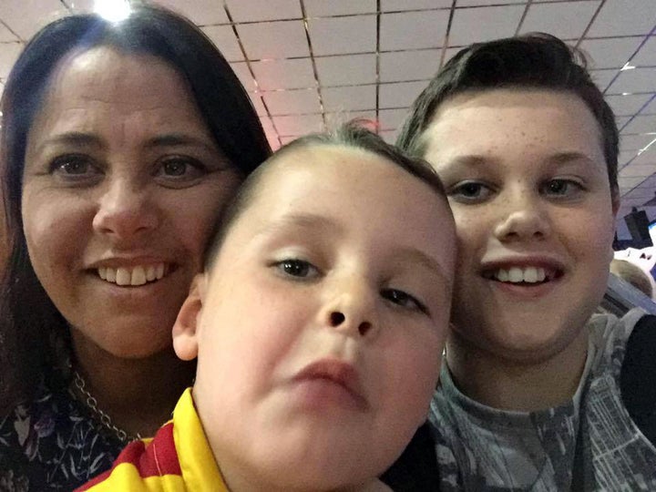 <strong>The boys pictured with their mother, Sally Stokes, who is in a stable condition in hospital </strong>