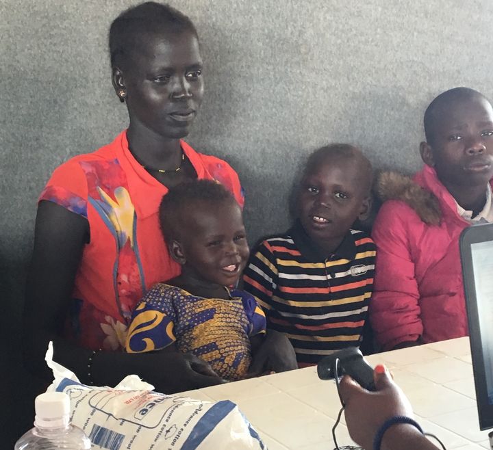 <p>Here a newly arrived South Sudanese refugee family is being registered by the Ugandan government. Once they are registered, refugees are given a plot of land to build their own homes and to cultivate, free access to health care and schools, the ability to work, and freedom to travel. </p>