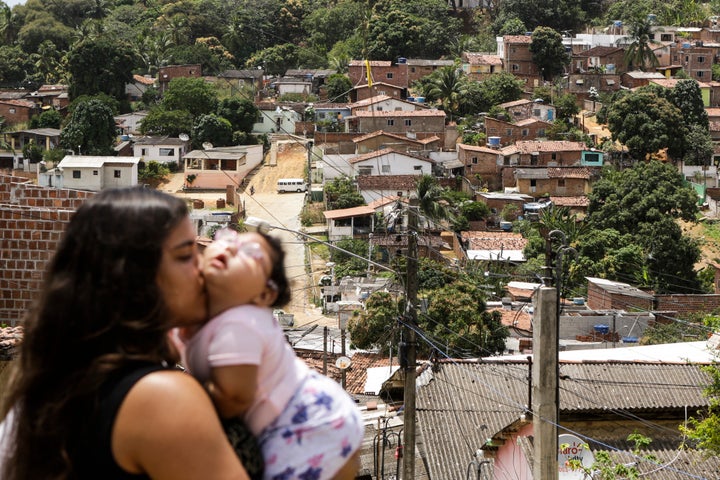 Cleane Stephanie with Maria Eduarda, only 11 months old, who has microcephaly caused by Zika virus. Olinda, Brazil,