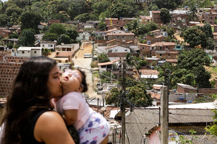 Cleane Stephanie with Maria Eduarda, only 11 months old, who has microcephaly caused by Zika virus. Olinda, Brazil, Oct. 24.