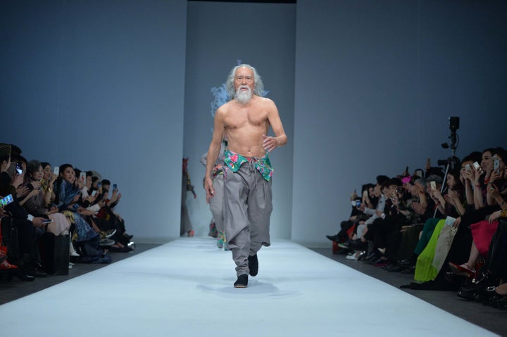 Wang Deshun struts a runway in 2015.