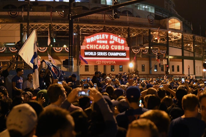 Chicago Cubs fans celebrate after game seven of the 2016 World Series against the Cleveland Indians outside of Wrigley Field.