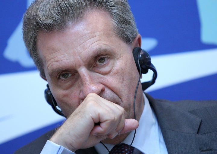 Above, Gunther Oettinger talks to press at a panel on the problems of the digital economy in Kiev, Ukraine on