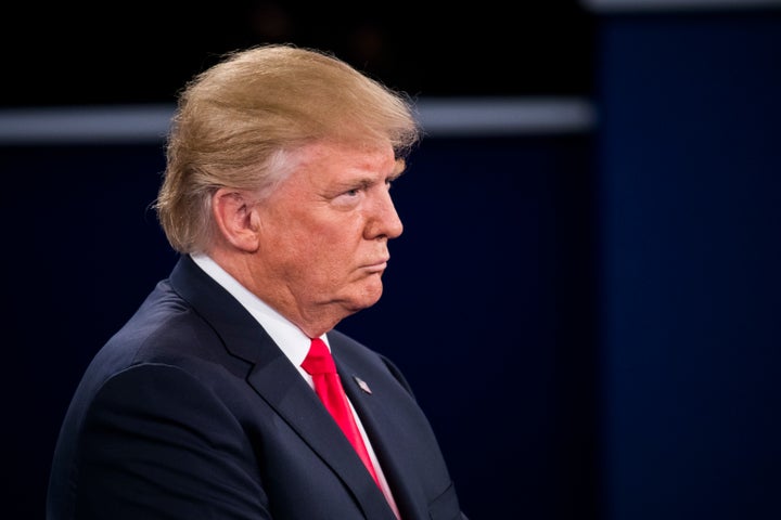 Republican presidential nominee Donald Trump listens during the town hall debate at Washington University on October 9, 2016 in St. Louis, Missouri. 