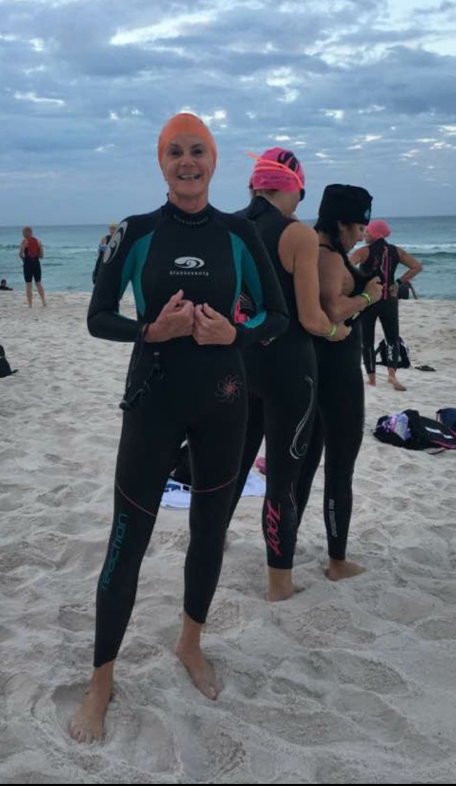 Gini Fellows, who’s competing in IRONMAN Florida on November 5, 2016, on Panama City Beach getting ready for a practice swim in the Gulf of Mexico