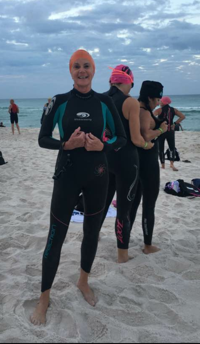 Gini Fellows, who’s competing in IRONMAN Florida on November 5, 2016, on Panama City Beach getting ready for a practice swim