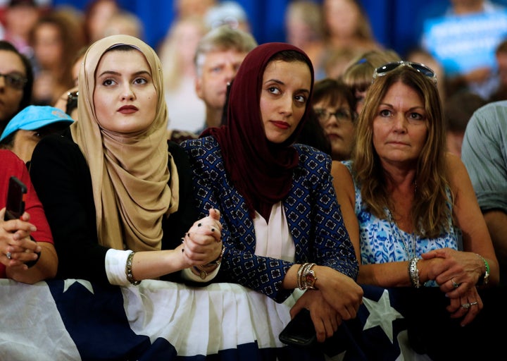 Supporters look on as U.S. Democratic presidential nominee Hillary Clinton speaks during a campaign rally in Saint Petersburg