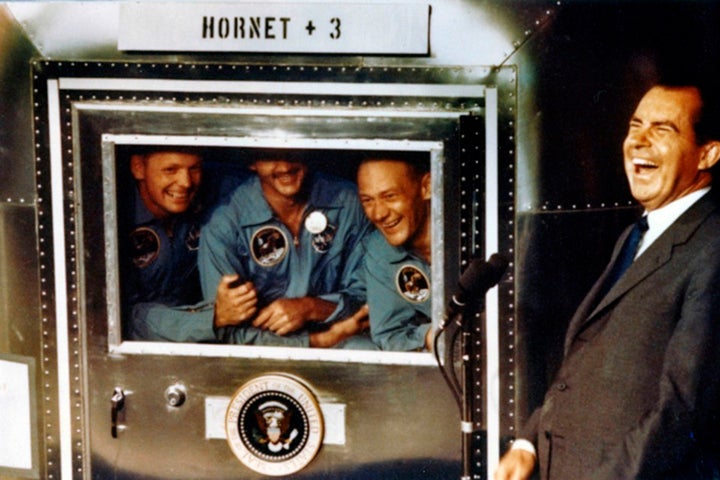 The Apollo XI astronauts Neil Armstrong, Michael Collins, and Buzz Aldrin with President Richard Nixon aboard the USS Hornet in 1969