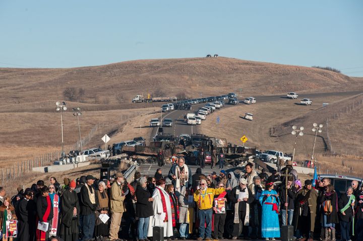 Members of the clergy from across the United States participate in a prayer circle in front of a bridge where demonstrators are facing off against police during a protest of the Dakota Access pipeline on the Standing Rock Indian Reservation near Cannonball, North Dakota November 3, 2016.