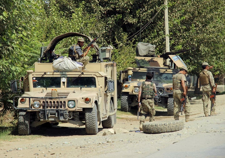 Afghan security forces prepare for battle on the outskirts of Kunduz in August.