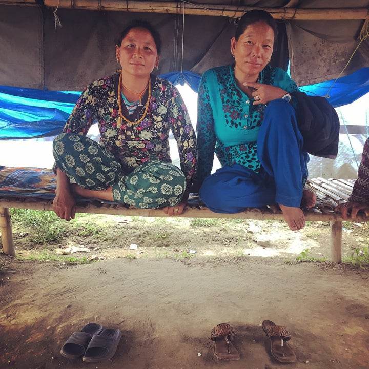 Mingmar Sherpa and Dawa Doma Sherpa in the main gathering tent of the refugee camp in Kathmandu, Nepal. 18 months after the earthquake destroyed their village, Phulping. 