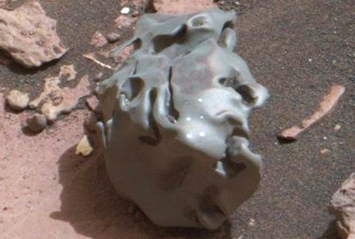 This close-up of the Martian meteorite discovered by the Curiosity rover shows several bright circular marks, the result of the space rock being zapped by the rover's laser equipment.