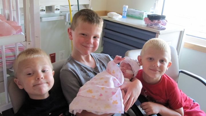 (My daughter at 3 months old and the first time my boys got to hold her)